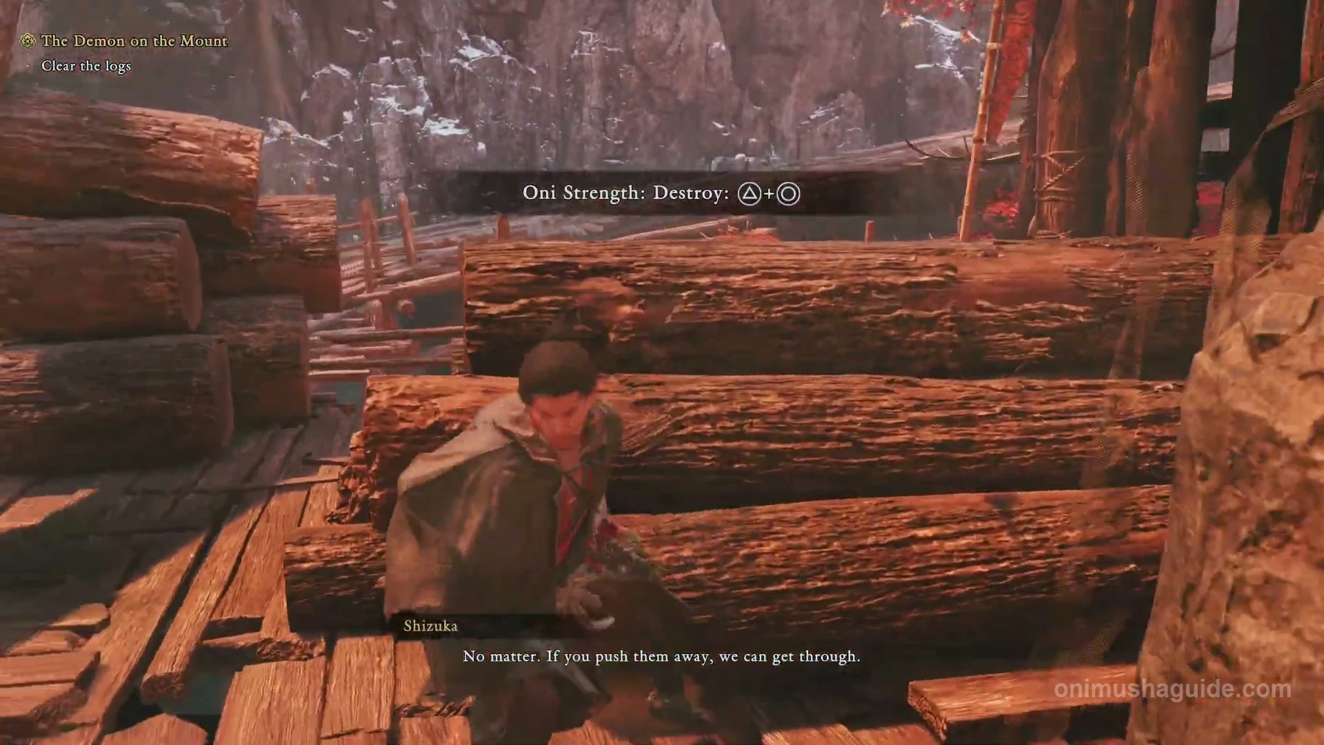 Destroy prompt showing Triangle plus Circle at the logs blocking the mountain path