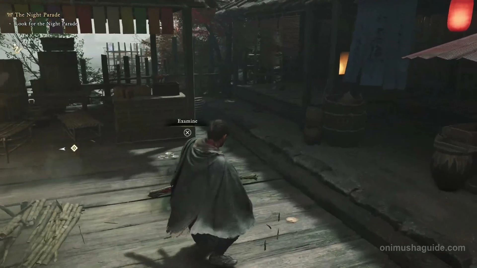 Examine prompt on the Hanamachi wooden platform beside the red parasols and bamboo benches