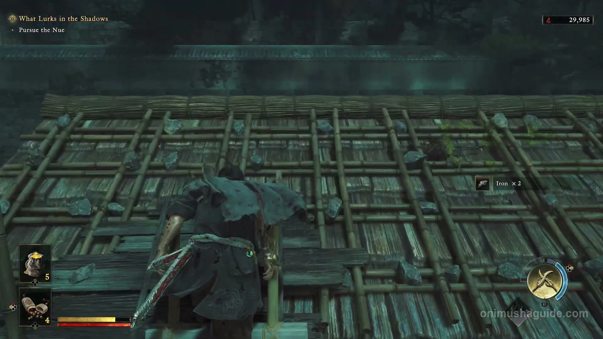 Collapsed bamboo roofing forming the route over the blocked street